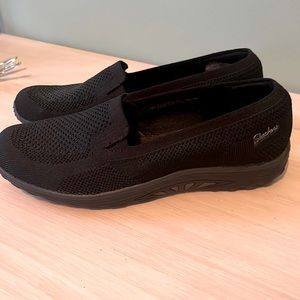 NWOT Skechers black slip ons